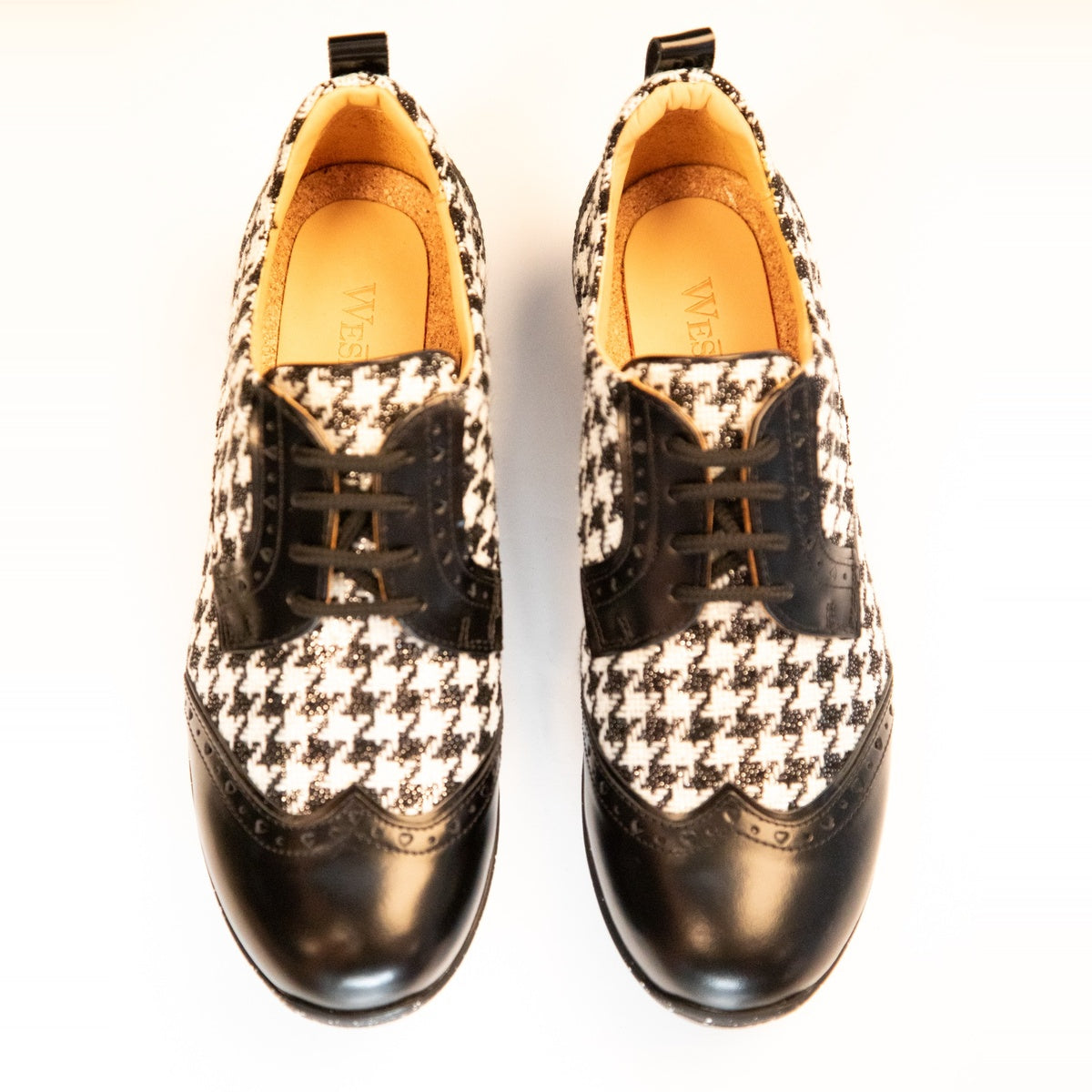 WesTees Javi shoes with elegant black and white Houndstooth pattern and black wingtip toe, offering classic elegance and comfort.