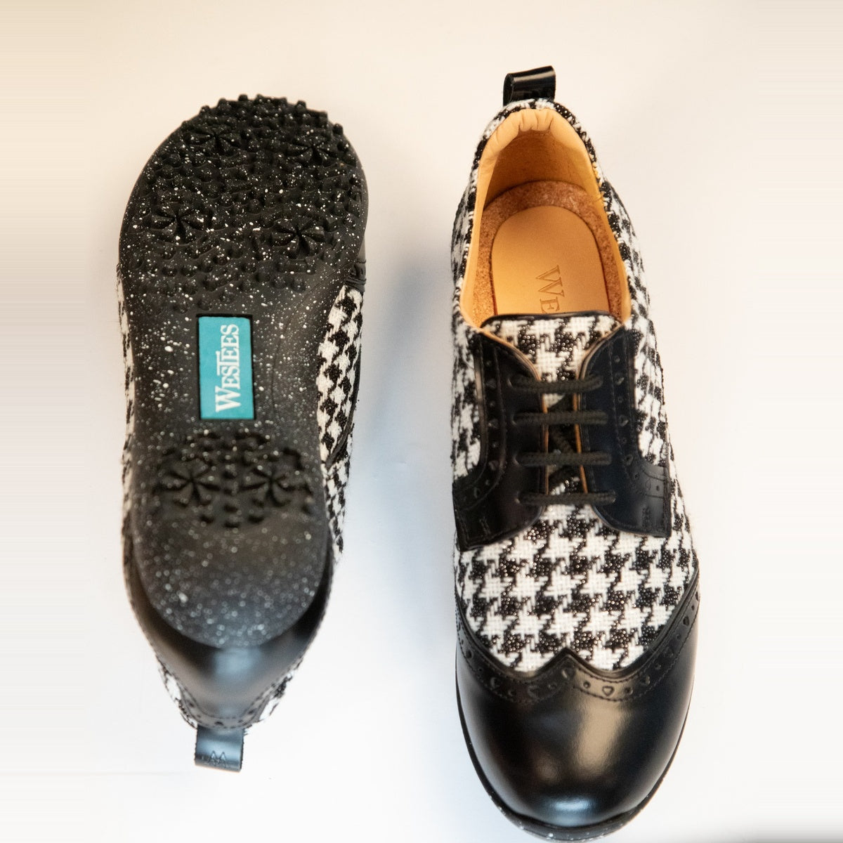 WesTees Javi shoes in black and white houndstooth pattern with black wingtip, featuring cork insole and foam cushioning for comfort.