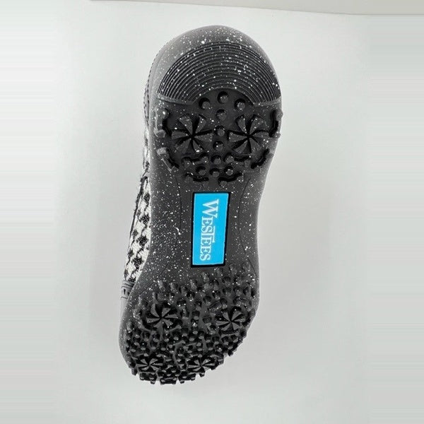 Sole of WesTees Javi shoe with durable grip and elegant houndstooth pattern.