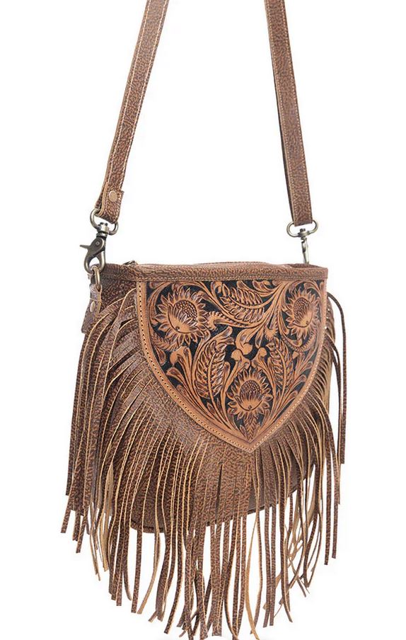 Hand tooled Fringe Bag with detailed leather panel and fringe accents, featuring Western craftsmanship and a spacious interior.