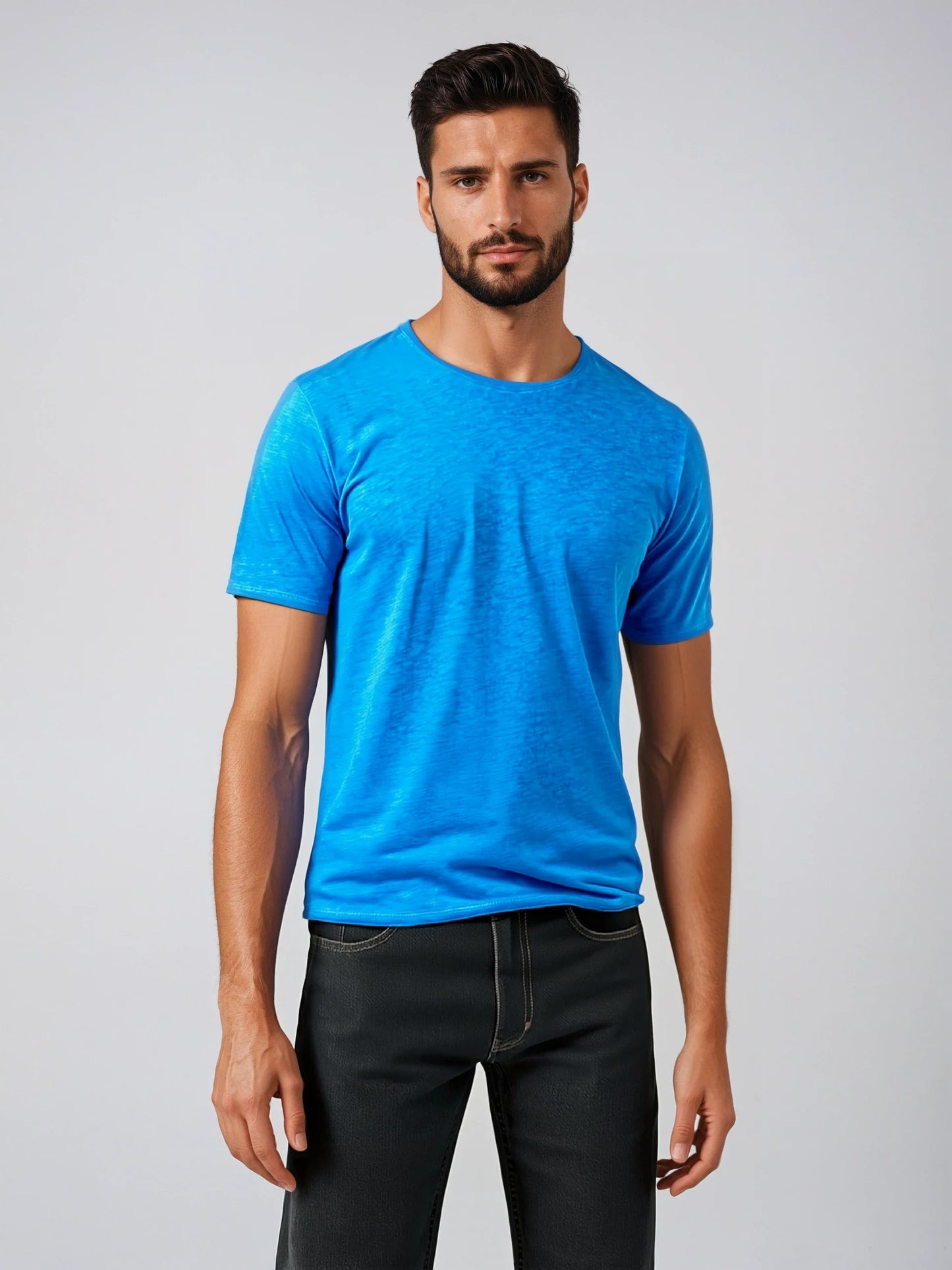 Model wearing vibrant blue Short Sleeve Roll Neck T for casual or formal wear, showcasing lightweight Italian fabric.