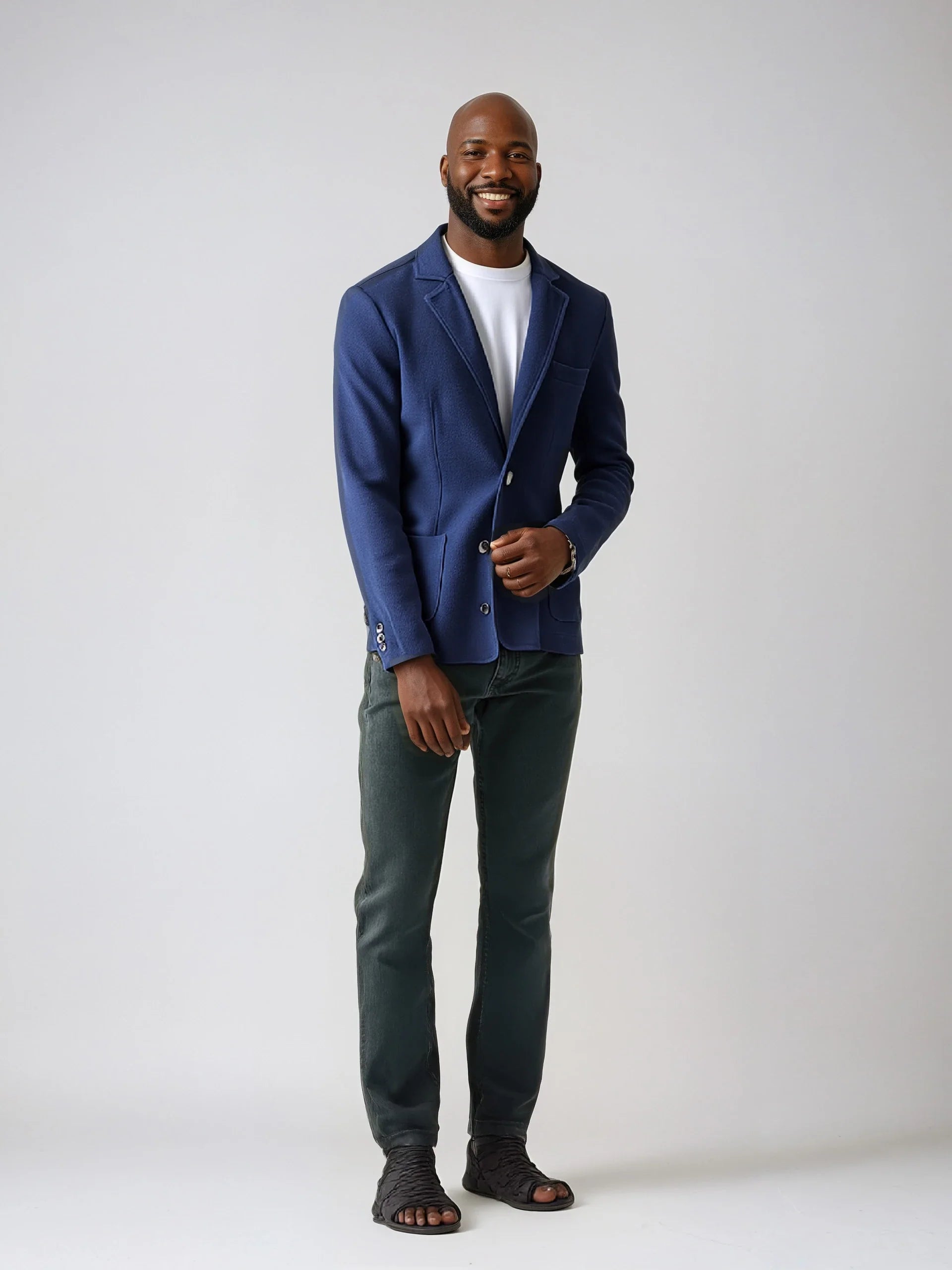 Sophisticated Knit Blazer with two buttons, patch pockets, floral paisley lining, worn with casual trousers for a stylish look.