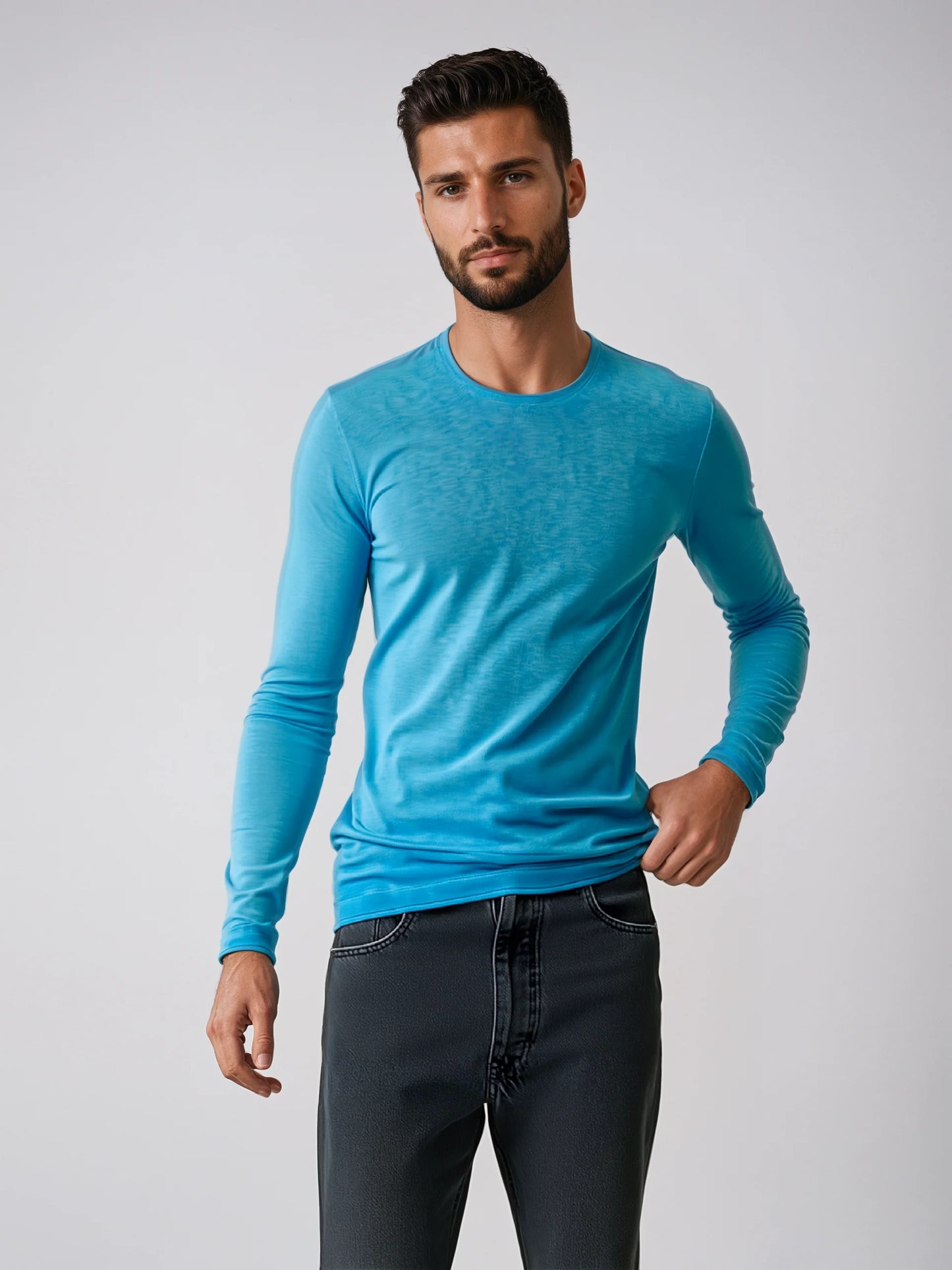 Man wearing a light blue Long Sleeve Sweater, showcasing casual style and soft cotton fabric. Ideal for various occasions.