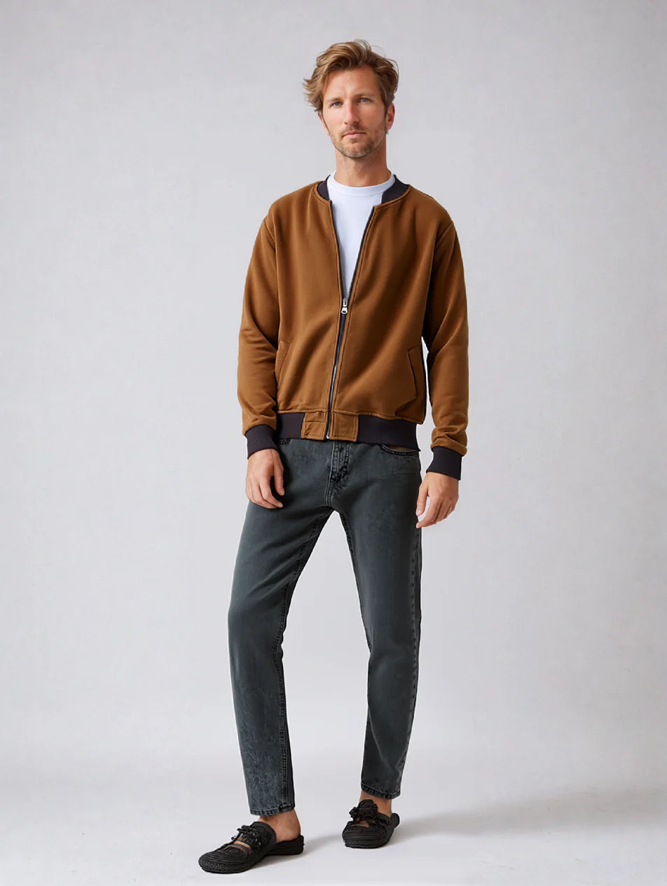 Man wearing brown micro fiber Baseball Jacket with ribbed waist and wrists, full-zip closure, comfortable for every day wear.