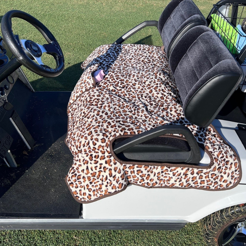 Golf Cart Seat Covers by Nailed Golf in leopard print, providing style and protection to your ride.