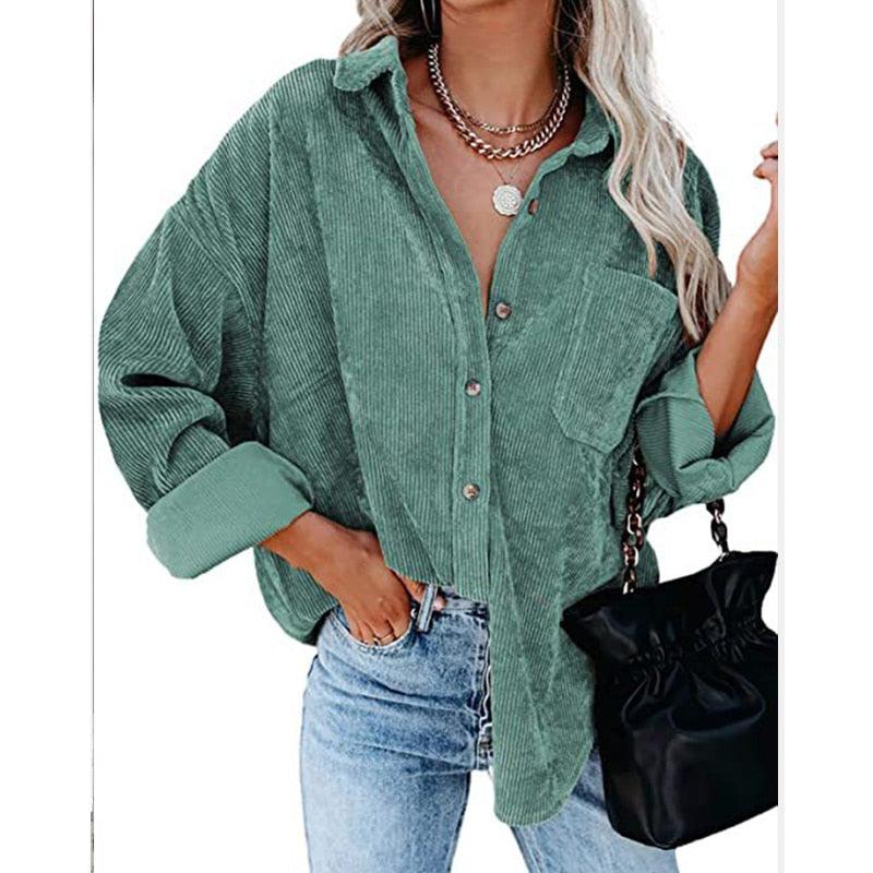 Woman wearing Corduroy Country Chic Shirt – Stylish Single-Breasted Cowgirl Shirt in green with denim jeans and a black bag.