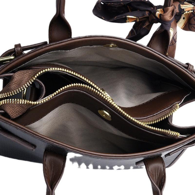 Inside view of the Serpent Luxe Snakeskin Handbag showing spacious interior with zipper and lined pockets, ideal for commuting women.