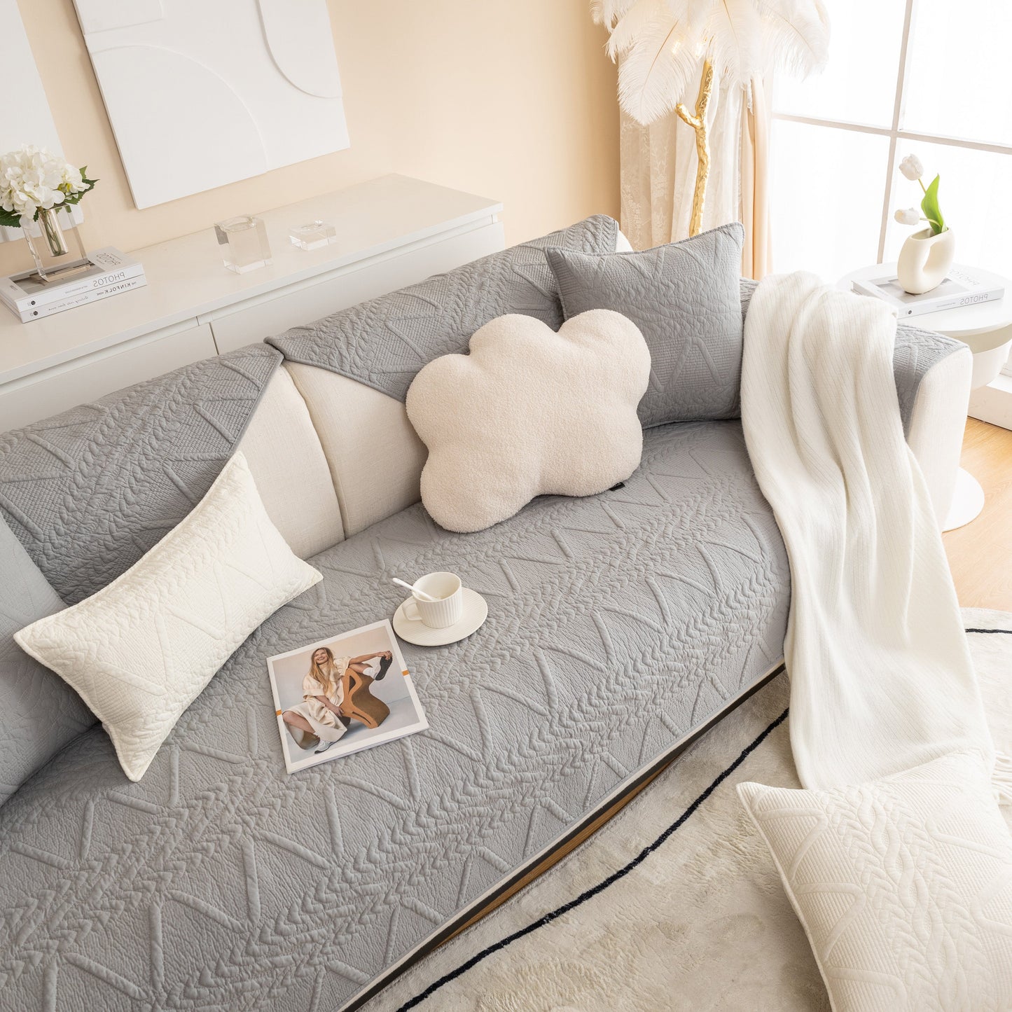 Living room showcasing Geometric Textured Cotton Quilted Sofa Cover, Non-Slip Washable Couch Protector with modern decor.