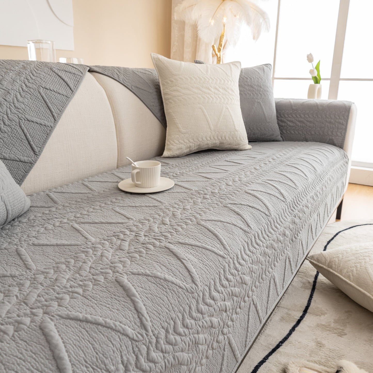Geometric Textured Cotton Quilted Sofa Cover, Non-Slip Washable Couch Protector; modern quilted design with V-shaped motifs.