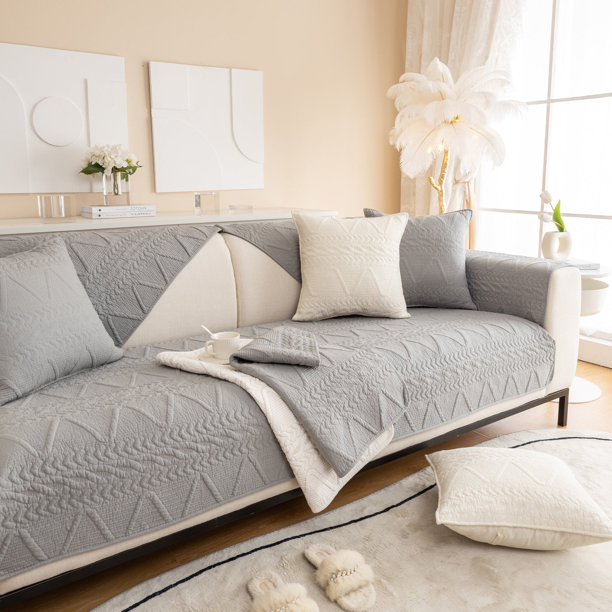 Geometric Textured Cotton Quilted Sofa Cover, Non-Slip Washable Couch Protector in modern living room setting.