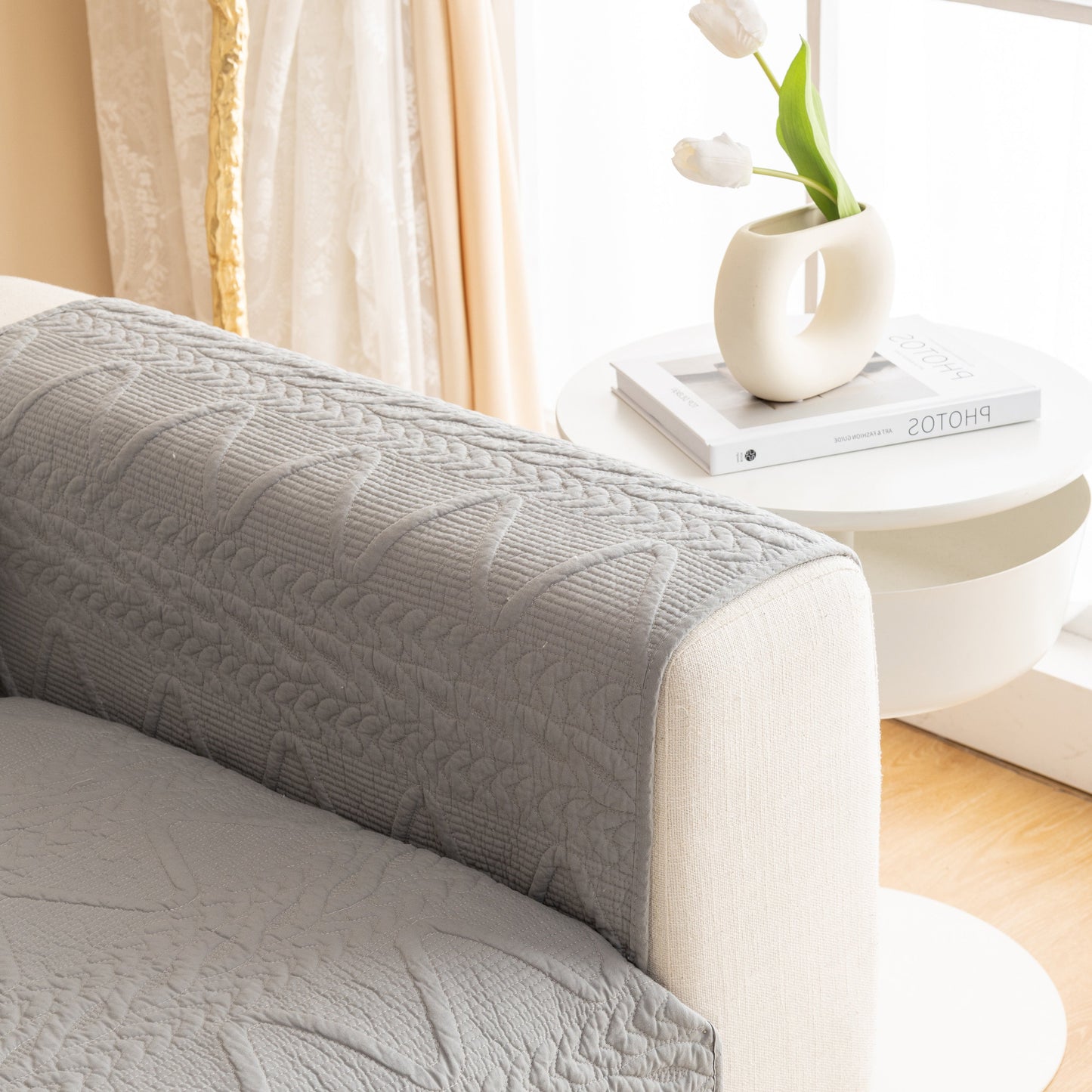 Geometric Textured Cotton Quilted Sofa Cover, Non-Slip Washable Couch Protector in grey, featuring modern V-shaped motifs.