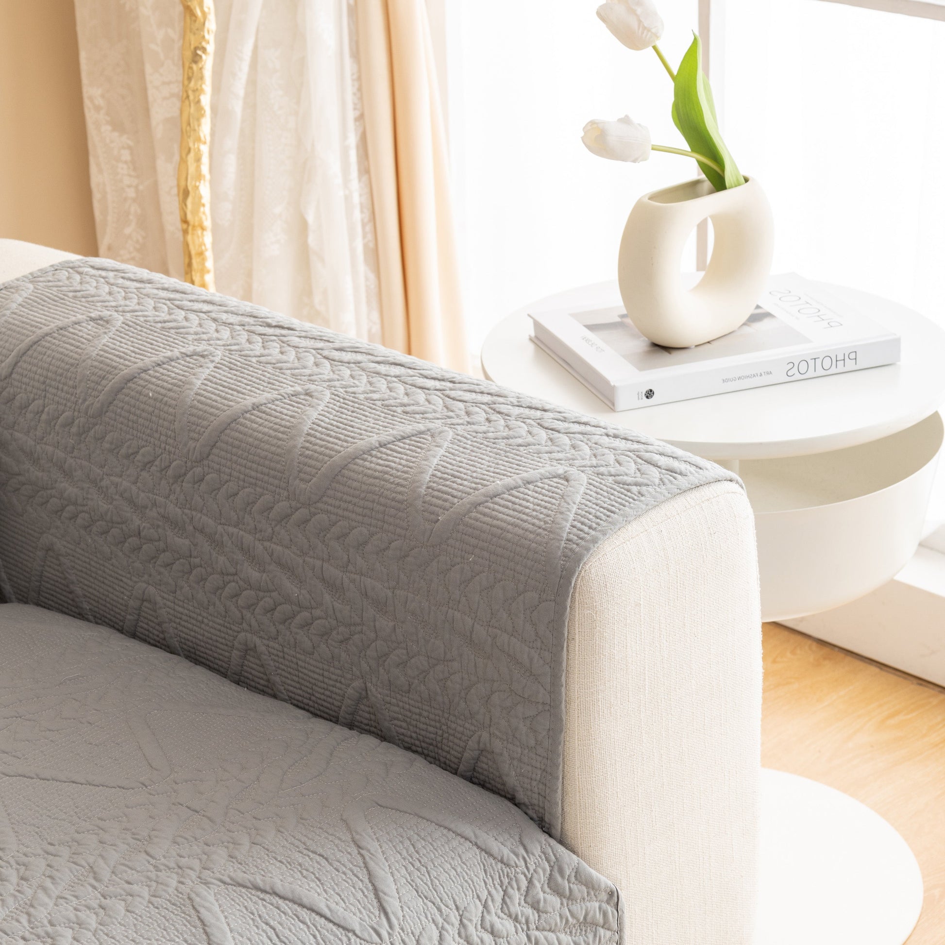 Geometric Textured Cotton Quilted Sofa Cover, Non-Slip Washable Couch Protector in grey, featuring modern V-shaped motifs.