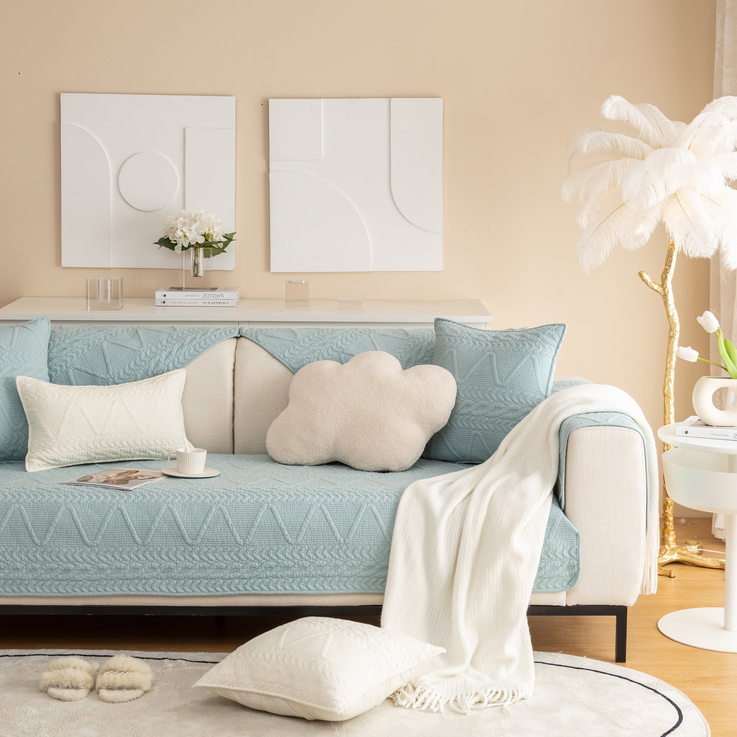 Geometric Textured Cotton Quilted Sofa Cover, Non-Slip Washable Couch Protector on blue sofa with modern décor.