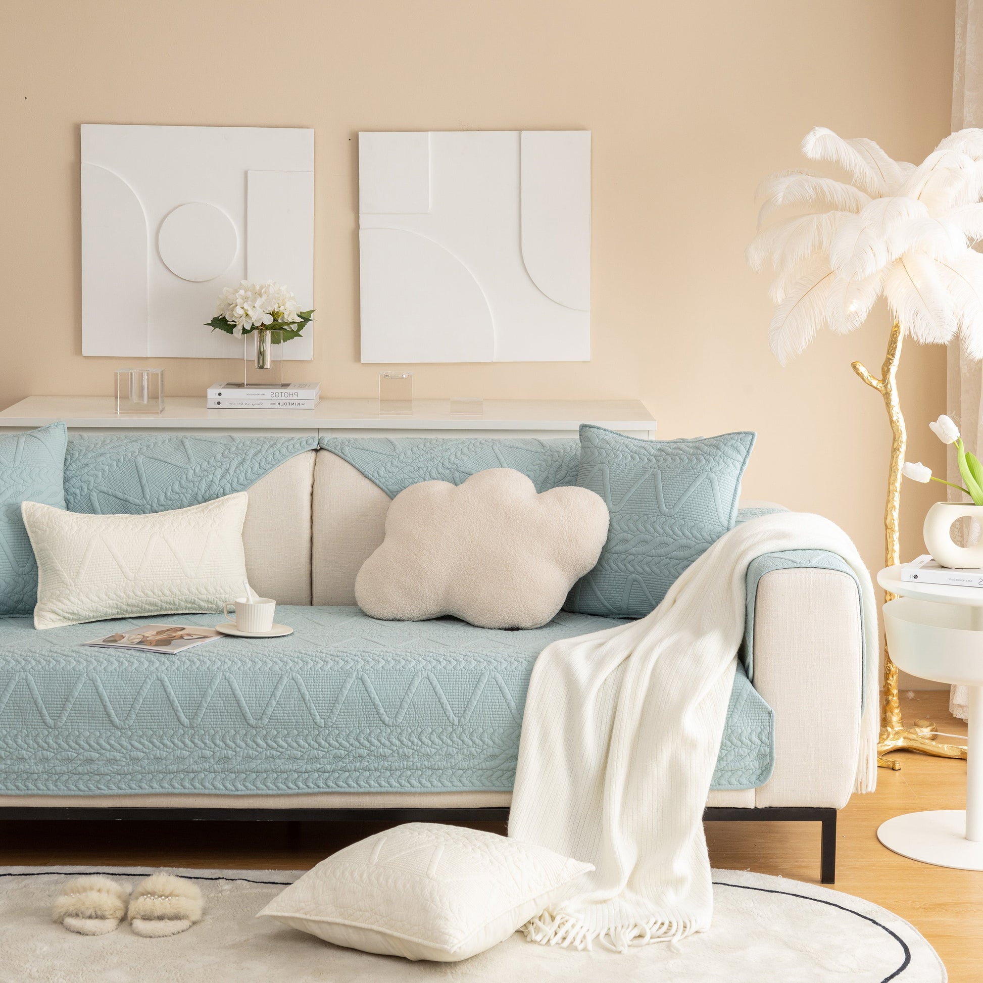 Geometric Textured Cotton Quilted Sofa Cover, Non-Slip Washable Couch Protector on blue sofa with modern décor.