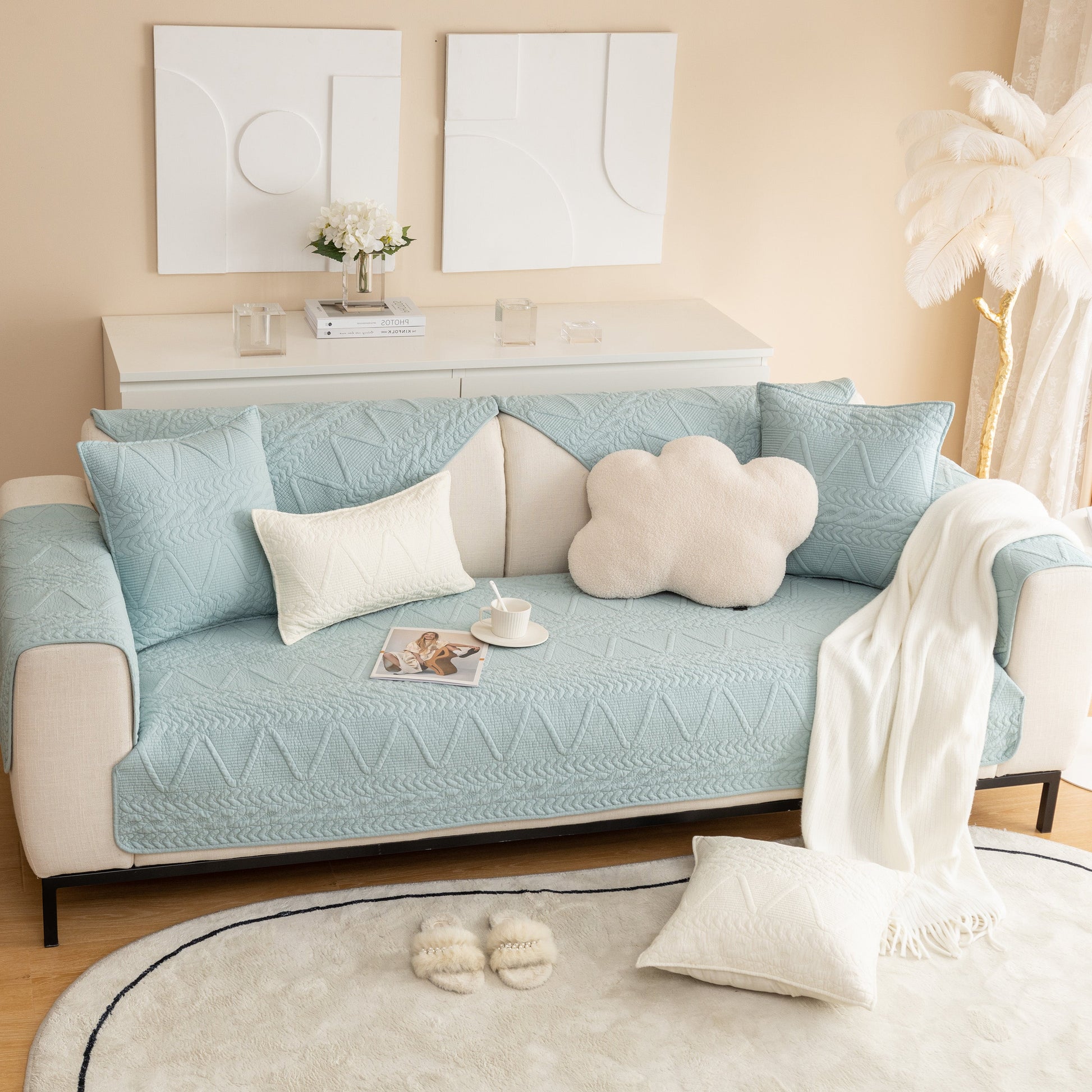 Geometric Textured Cotton Quilted Sofa Cover, Non-Slip Washable Couch Protector in a modern living room setting with decorative pillows.