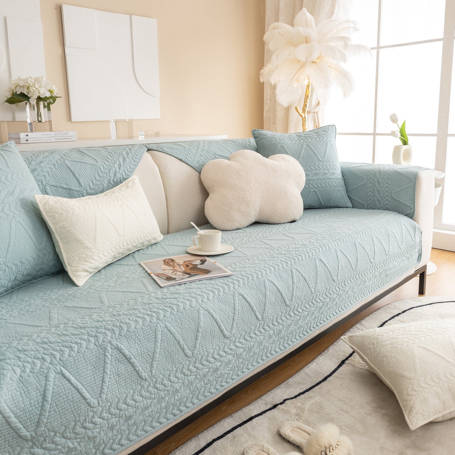 Geometric Textured Cotton Quilted Sofa Cover, Non-Slip Washable Couch Protector on a modern living room sofa with decorative pillows