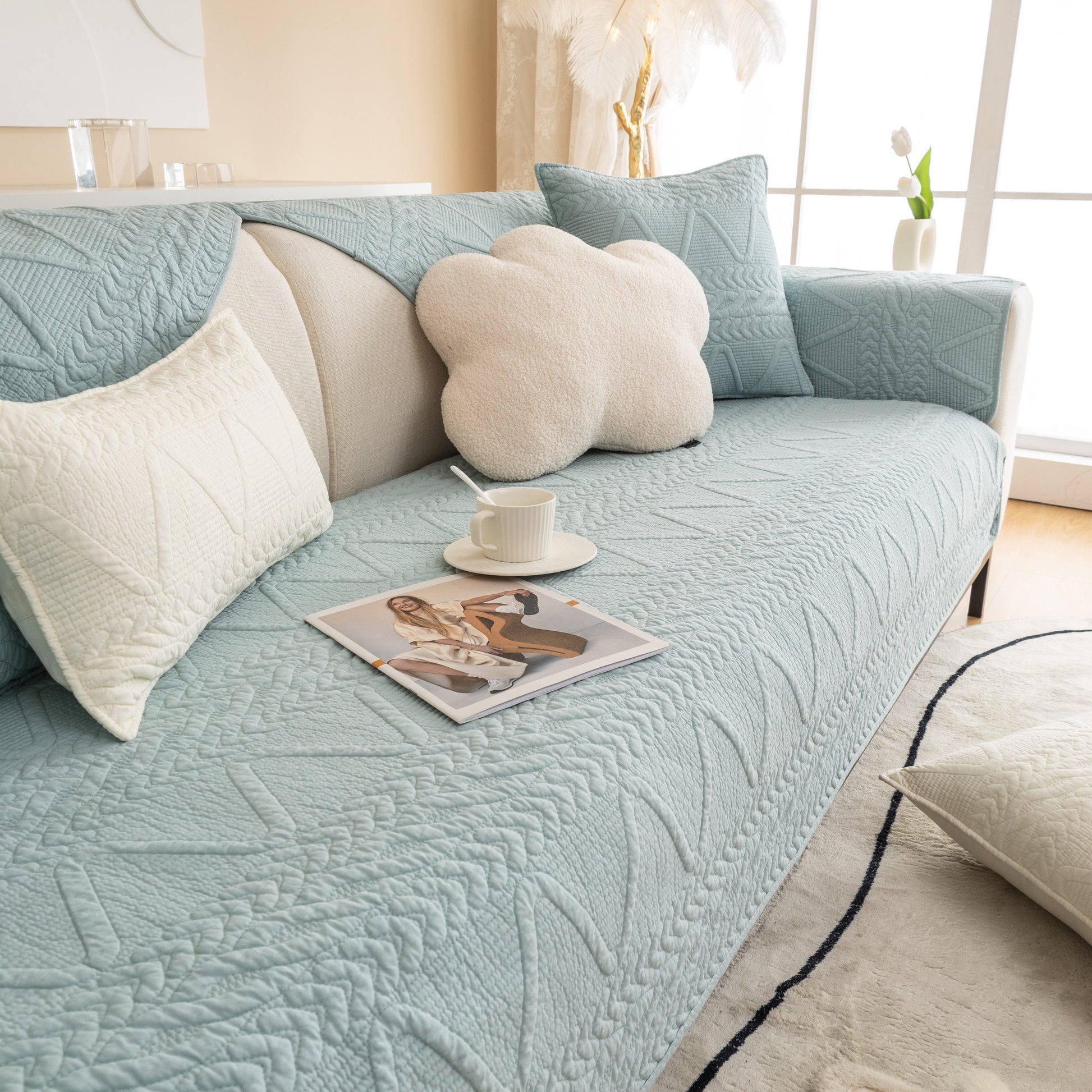 Geometric Textured Cotton Quilted Sofa Cover, Non-Slip Washable Couch Protector in modern living room setting.