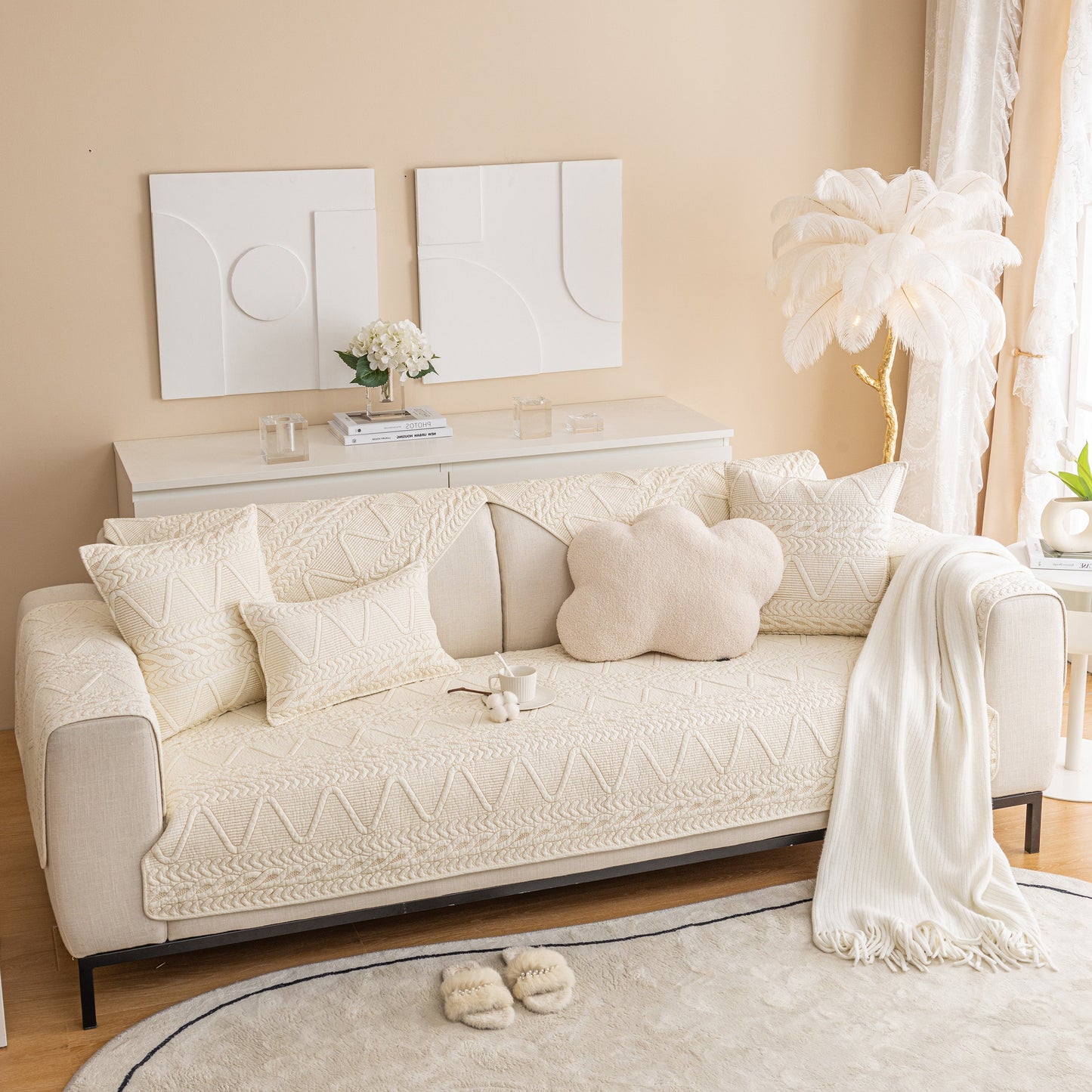 Geometric Textured Cotton Quilted Sofa Cover, Non-Slip Washable Couch Protector on modern cream sofa in stylish living room.