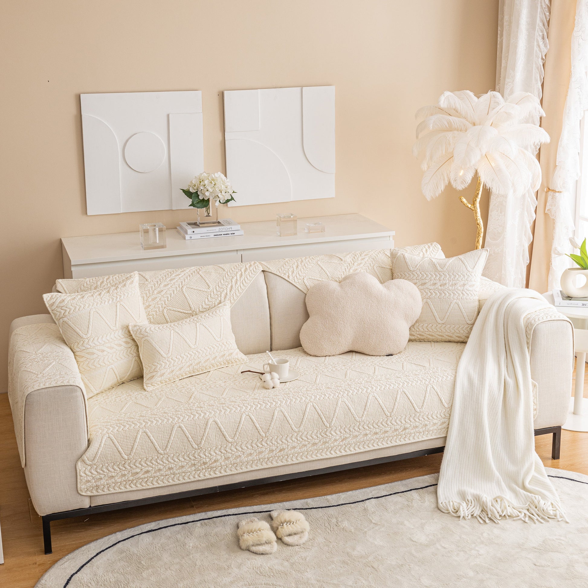 Geometric Textured Cotton Quilted Sofa Cover, Non-Slip Washable Couch Protector on modern cream sofa in stylish living room.