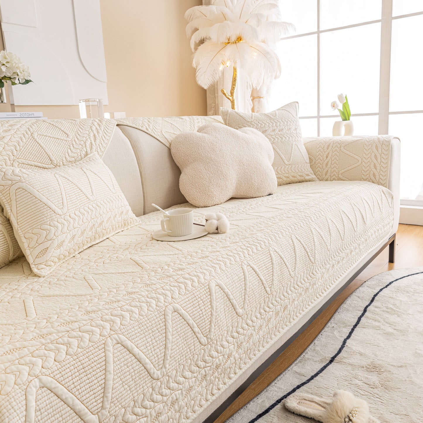 Geometric Textured Cotton Quilted Sofa Cover, Non-Slip Washable Couch Protector on a modern living room sofa.