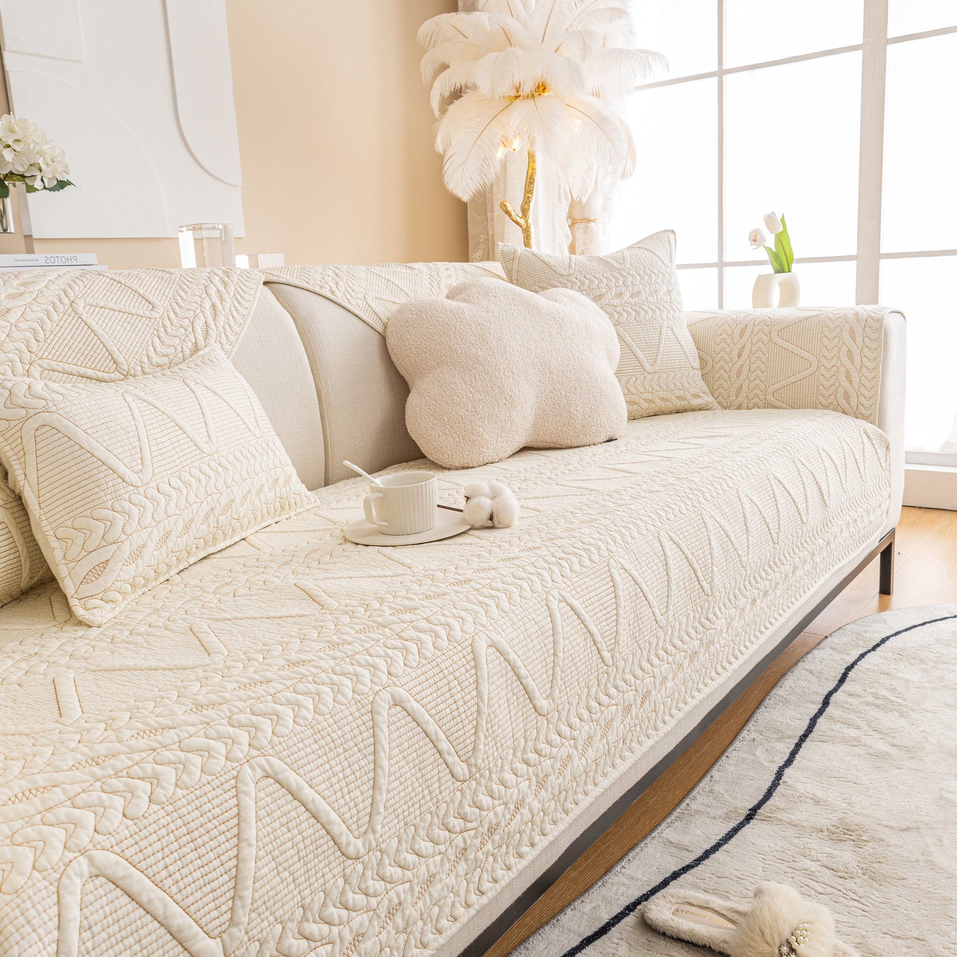 Geometric Textured Cotton Quilted Sofa Cover, Non-Slip Washable Couch Protector on a modern living room sofa.