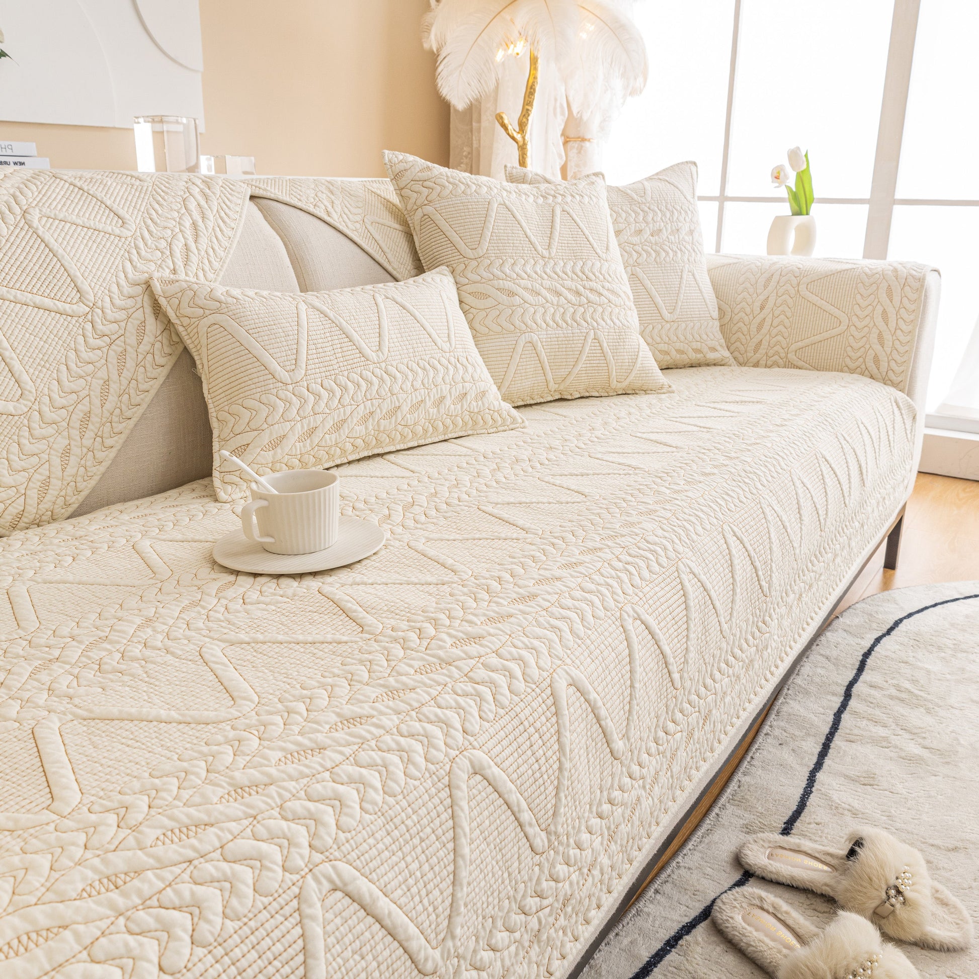 Geometric Textured Cotton Quilted Sofa Cover, Non-Slip Washable Couch Protector in a modern living room setting.