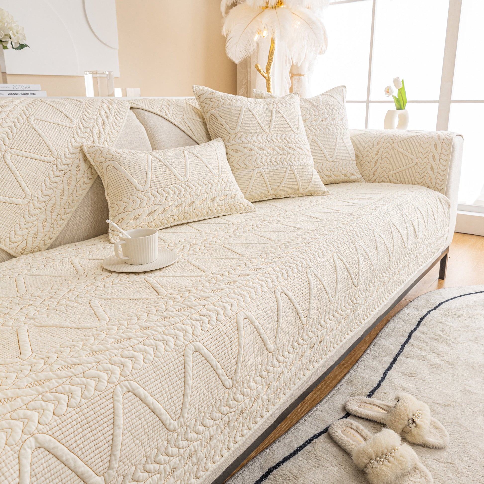 Geometric Textured Cotton Quilted Sofa Cover, Non-Slip Washable Couch Protector on modern living room couch with pillows