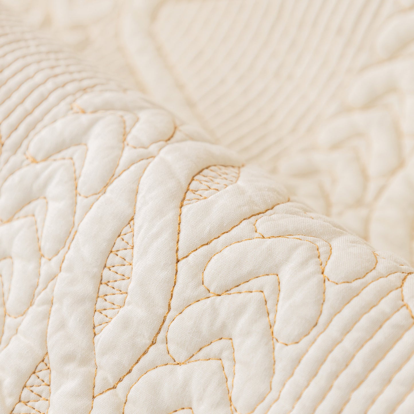 Close-up of Geometric Textured Cotton Quilted Sofa Cover, Non-Slip Washable Couch Protector with intricate stitching.