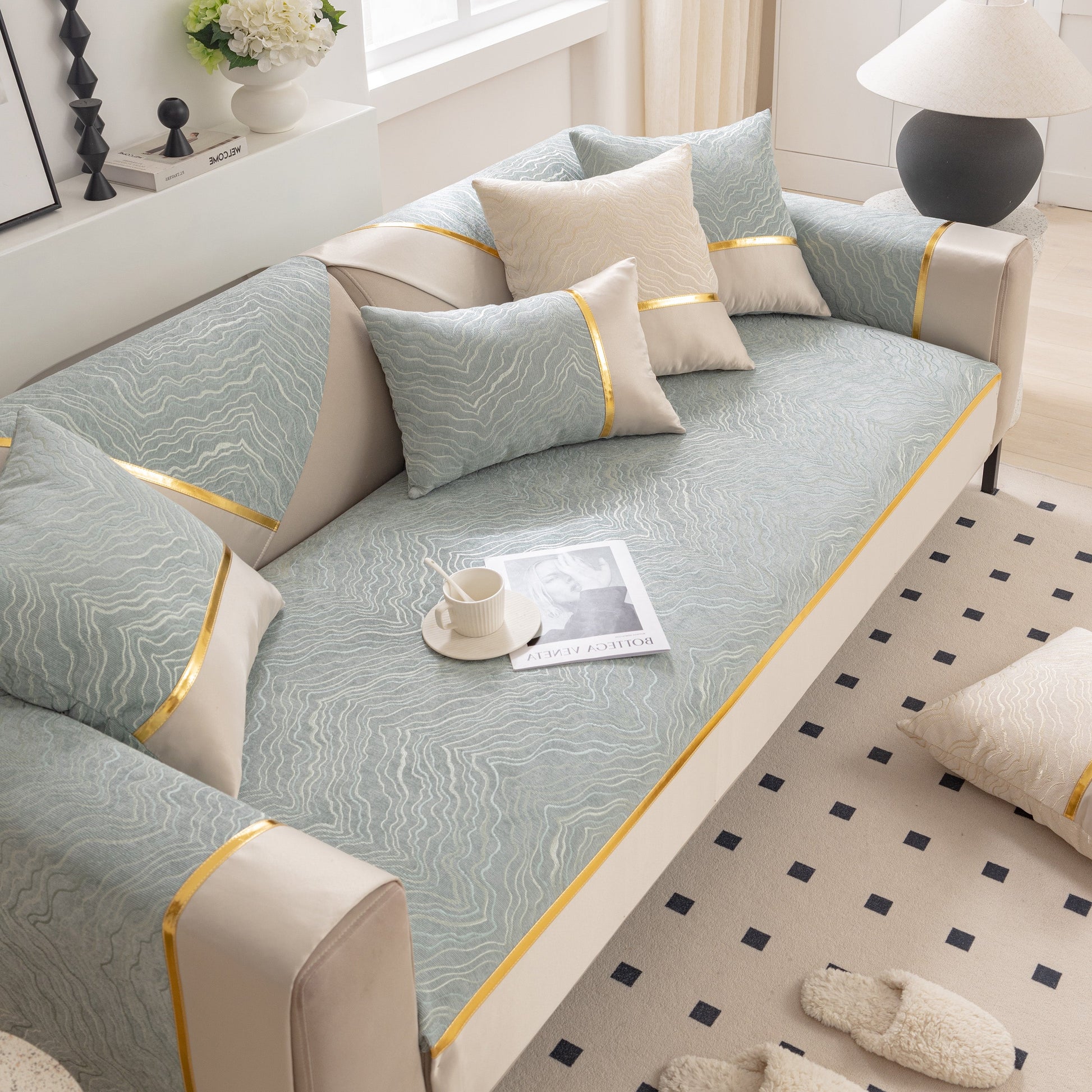 Modular Sofa Cover for Sectionals, Gold Striped Non-Slip Couch Protector with wave pattern and gold accents on modern sectional sofa.