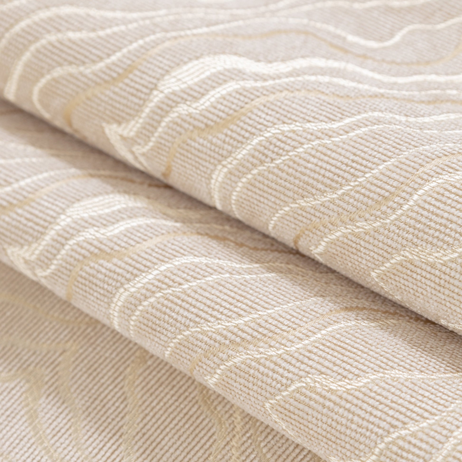 Close-up of Modular Sofa Cover for Sectionals, Gold Striped Non-Slip Couch Protector with wave pattern texture and decorative gold stripes.
