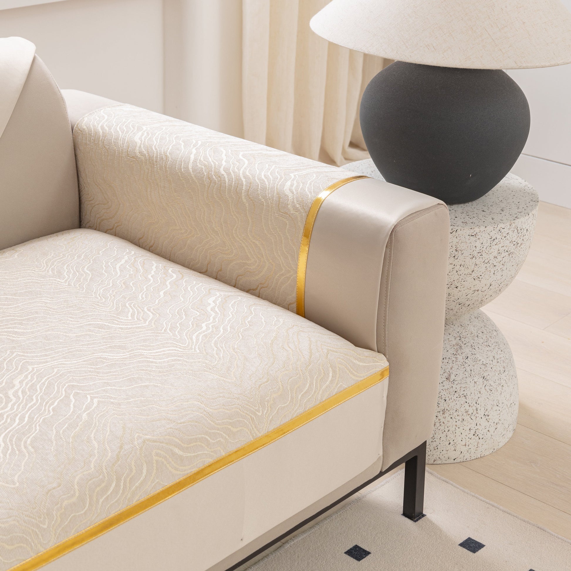 alt_text: Modular Sofa Cover for Sectionals, Gold Striped Non-Slip Couch Protector on light beige sectional sofa in modern living room.