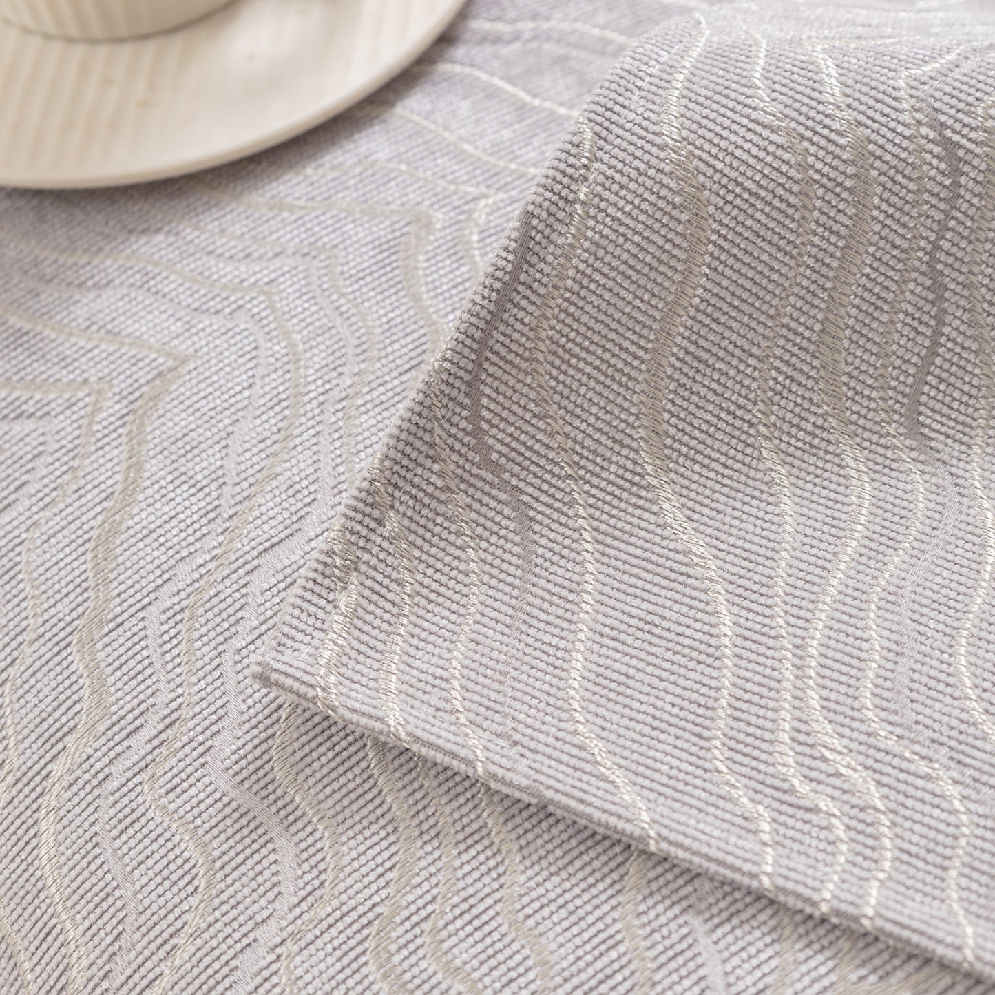 Close-up of Modular Sofa Cover for Sectionals, Gold Striped Non-Slip Couch Protector with wave pattern and elegant gold stripes.