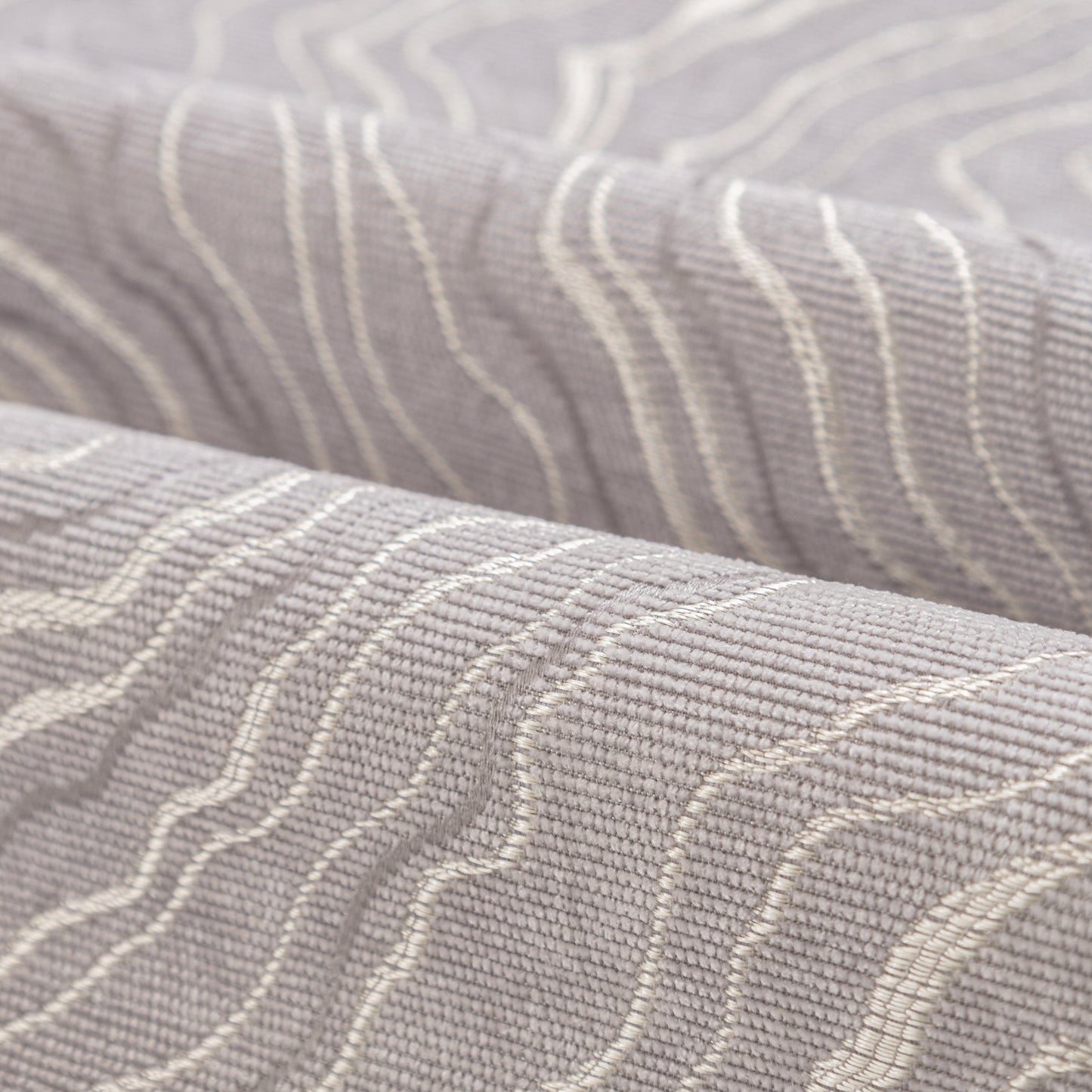 Close-up view of the texture on the Modular Sofa Cover for Sectionals, Gold Striped Non-Slip Couch Protector, showcasing an irregular wave pattern.