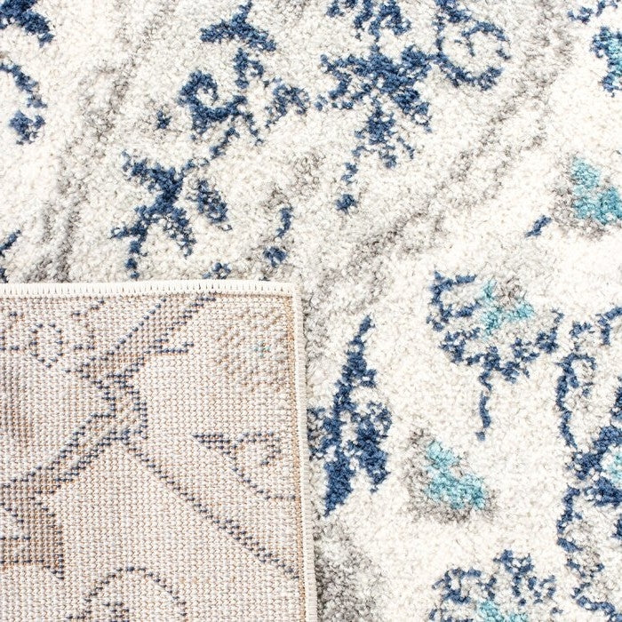 Close-up of 3' x 5' Coastal Blue Grey Damask Indoor Area Rug with cream, light gray, and navy damask pattern, showing texture detail.