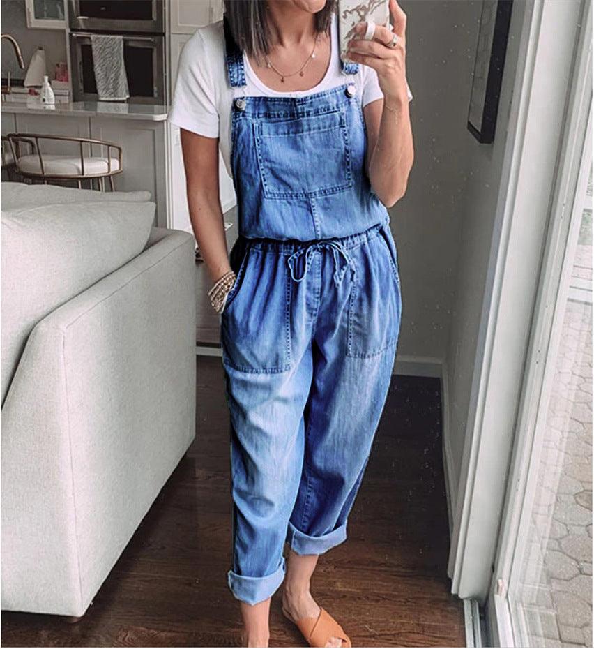 Woman wearing Cowgirl Drawstring Denim Overalls, standing in living room, showing comfort and style for every cowgirl.