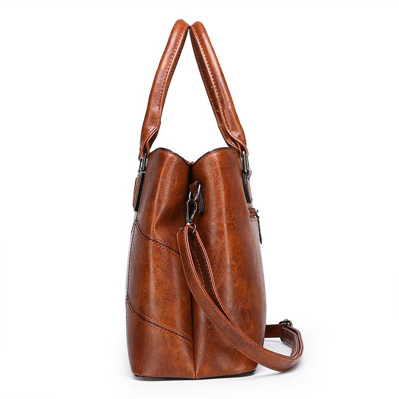 Side view of a brown Luxury 3 Piece Leather Tote Set | Genuine Leather Cowgirl Shoulder Bag & Clutch.