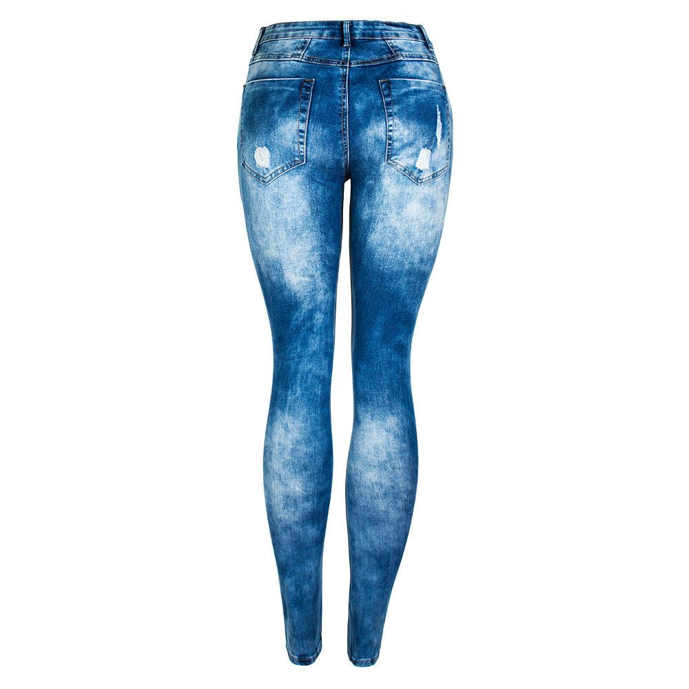 Back view of CurveFit Distressed Denim Jeans in stone-washed blue with distressed detailing for a trendy look.