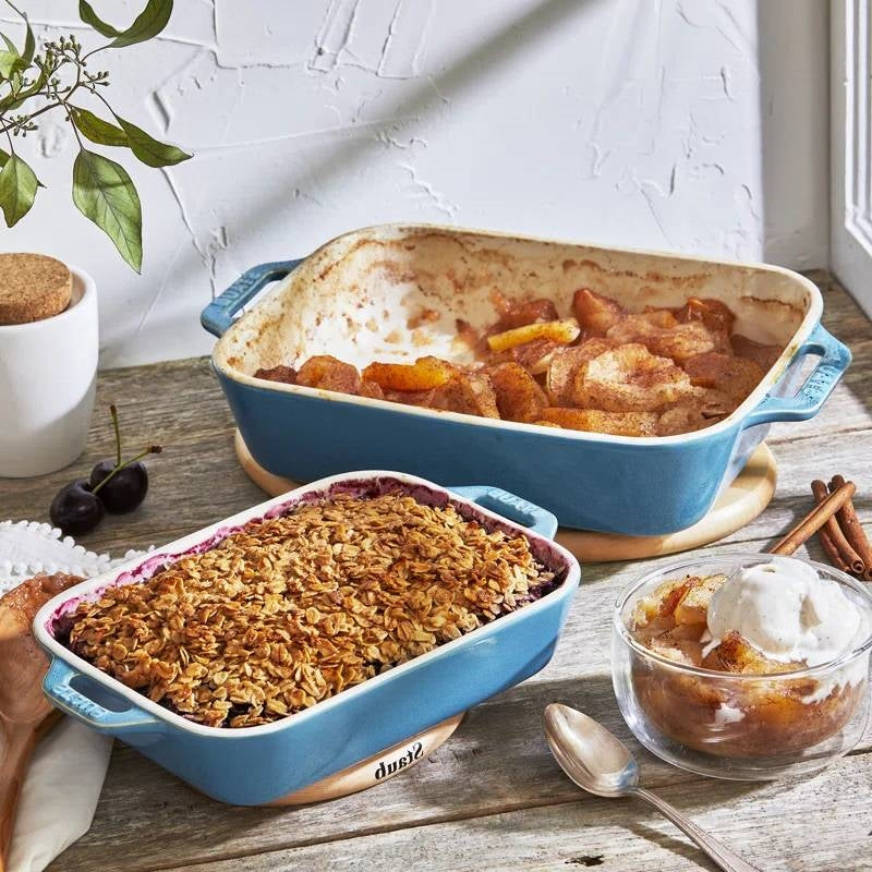 Set of 2 - Ceramic Stoneware Baking Dish Set in Blue Green Turquoise Ivory with baked dishes on a kitchen counter.