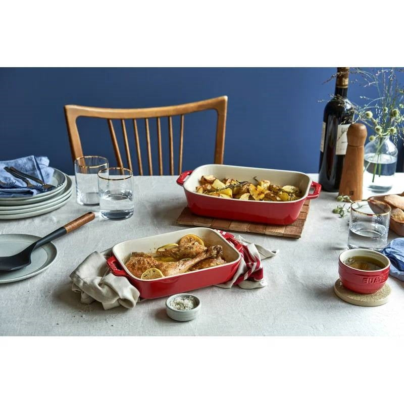 2 Piece Ceramic Stoneware Baking Dish Set in Cherry Red / Ivory with food on table
