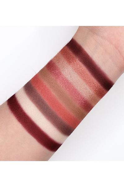 Café - GES14 eyeshadow swatches showcasing matte and shimmer shades on forearm. Professional-grade 13.5g palette for versatile looks.
