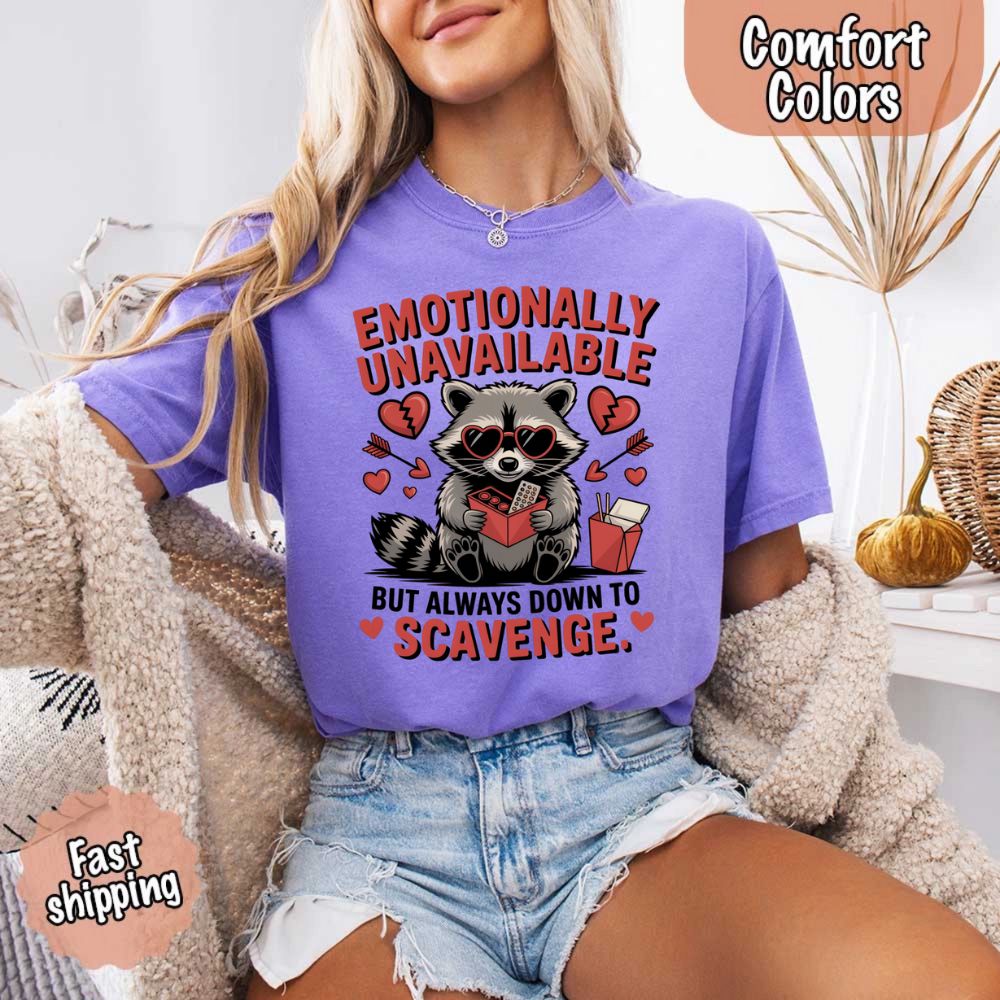 Comfort Colors Emotionally Unavailable Raccoon T-Shirts with a cute raccoon design, showcasing a humorous and moody style for casual wear.