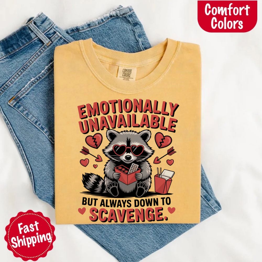 Comfort Colors Emotionally Unavailable Raccoon T-Shirts with moody raccoon graphic on yellow tee, heart details, fast shipping