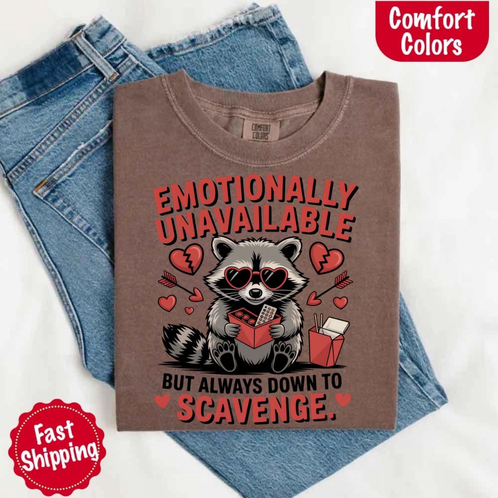 Comfort Colors Emotionally Unavailable Raccoon T-Shirts on denim background
