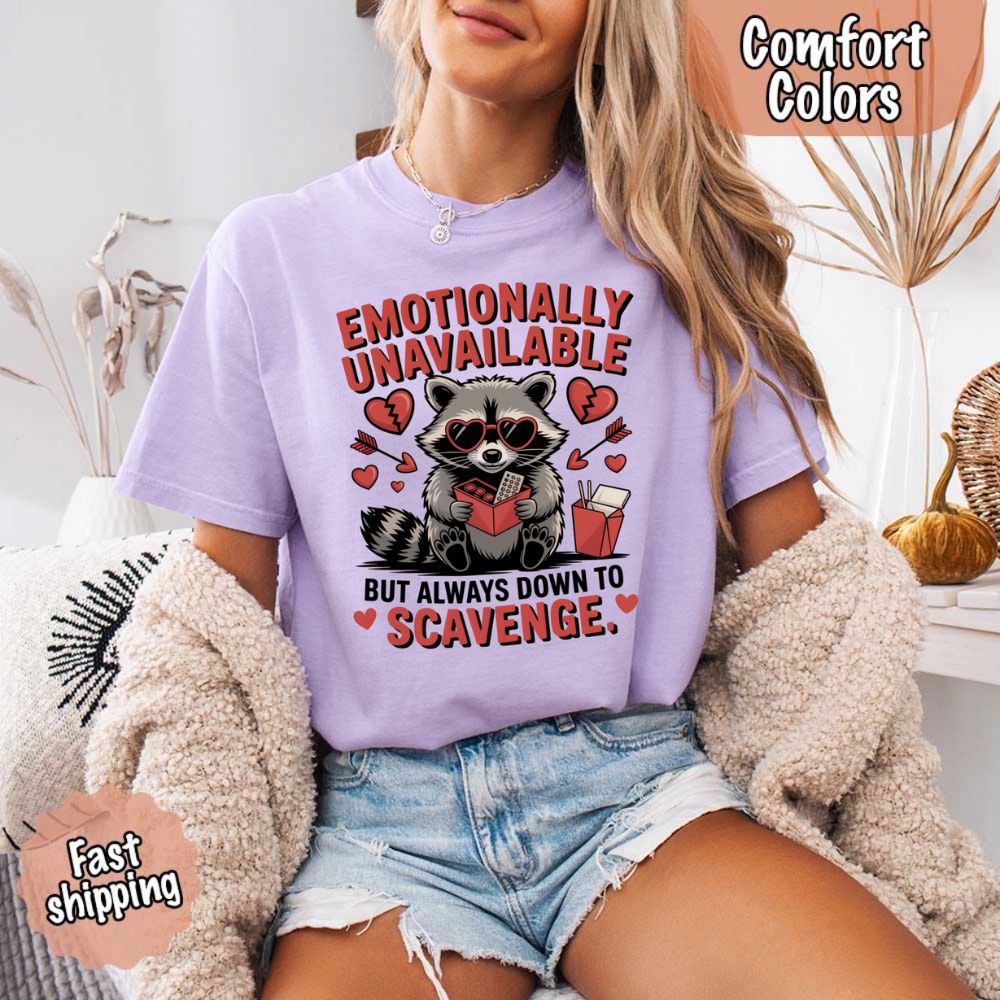 Comfort Colors Emotionally Unavailable Raccoon T-Shirts on model, lavender tee with humorous raccoon print, casual wear, fast shipping