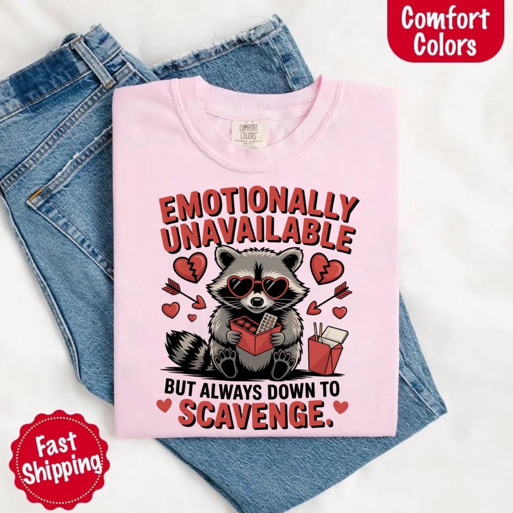 Comfort Colors Emotionally Unavailable Raccoon T-Shirts featuring a moody raccoon, perfect for those with zero emotional availability.