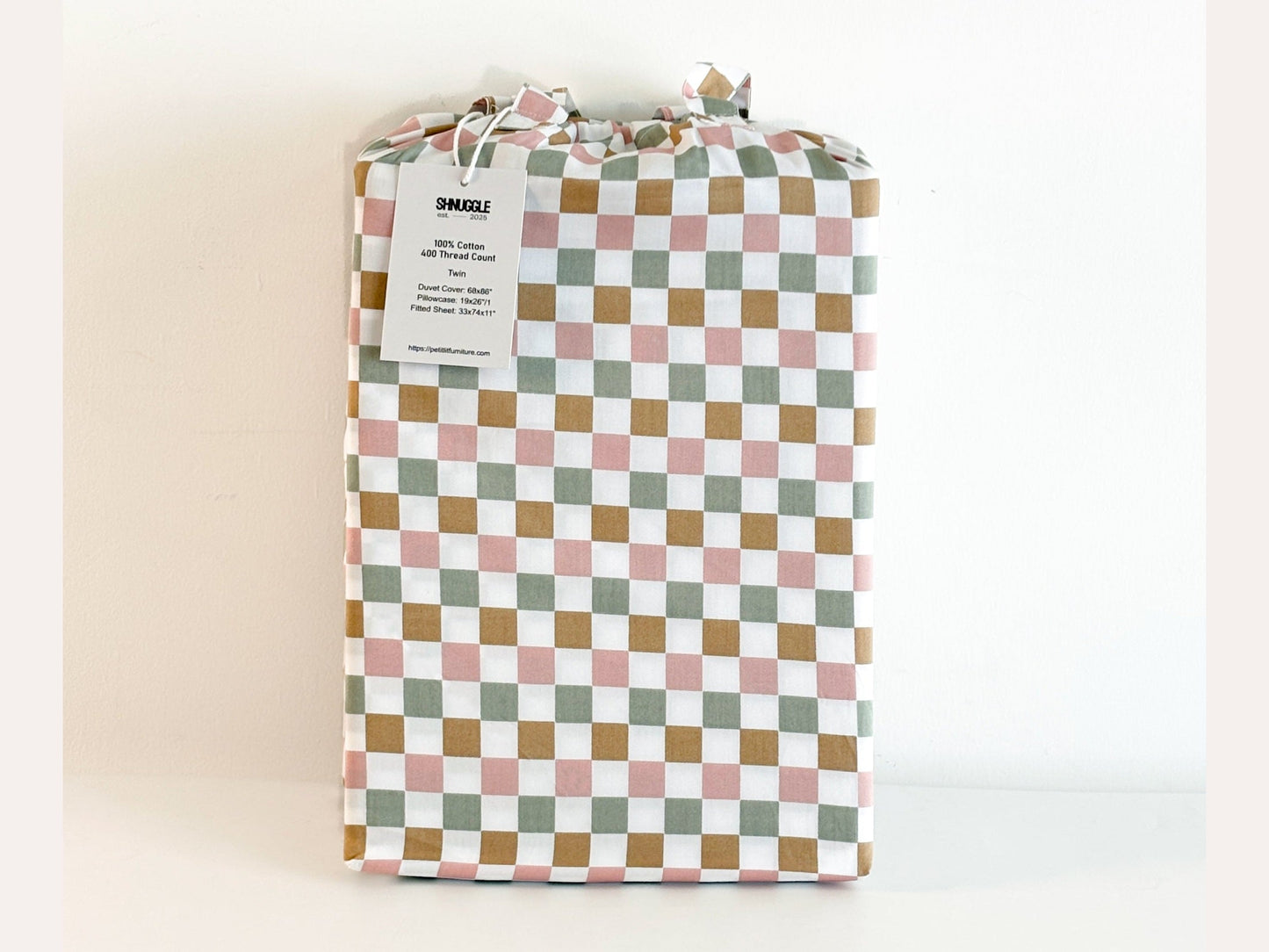 SHNUGGLE Bedding Set Colorful Checker in packaging, showcasing multi-color checker pattern ideal for cozy, stylish bedrooms.