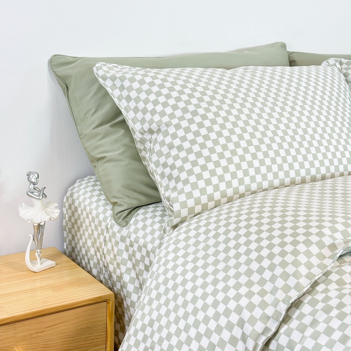SHNUGGLE Bedding Set Sage Checker with checkered duvet cover on a neatly made bed
