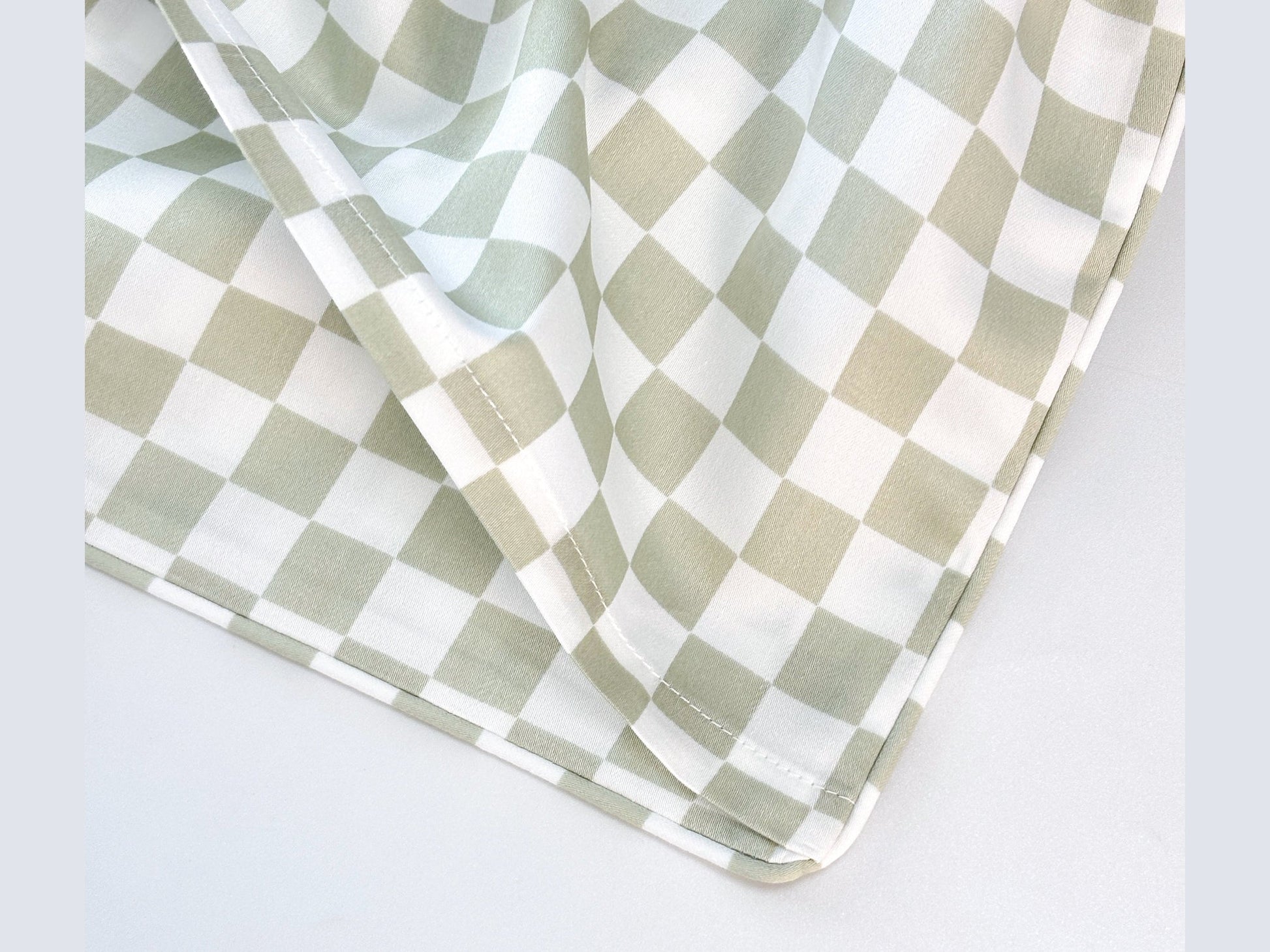 SHNUGGLE Extra Pillowcase- Sage Checker design featuring a soft, checkered pattern for bedding sets.