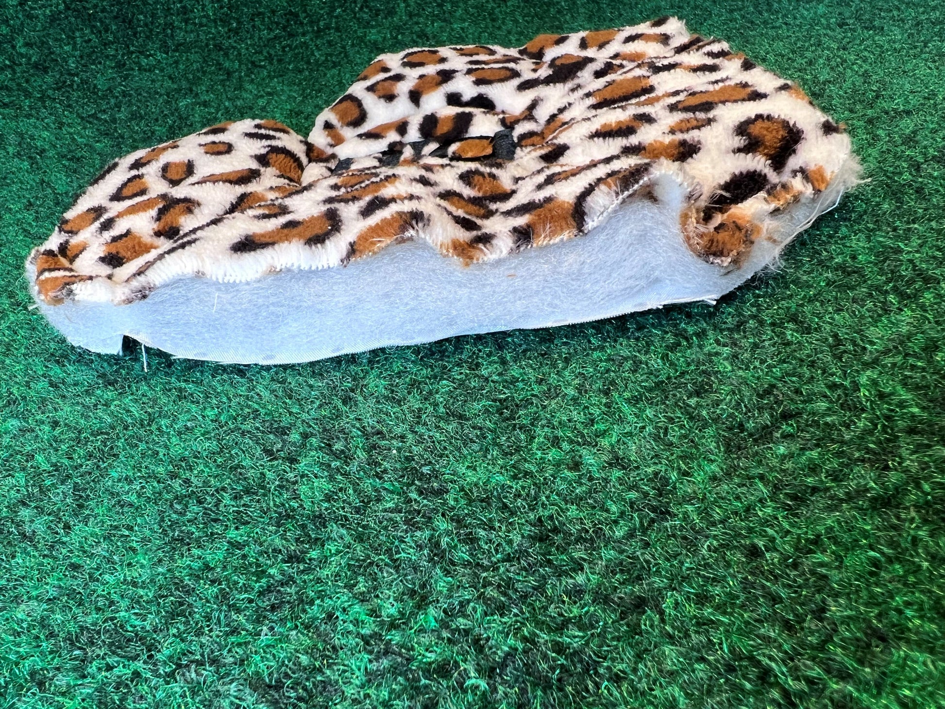 Leopard print Golf Cart Seat Covers on a green background