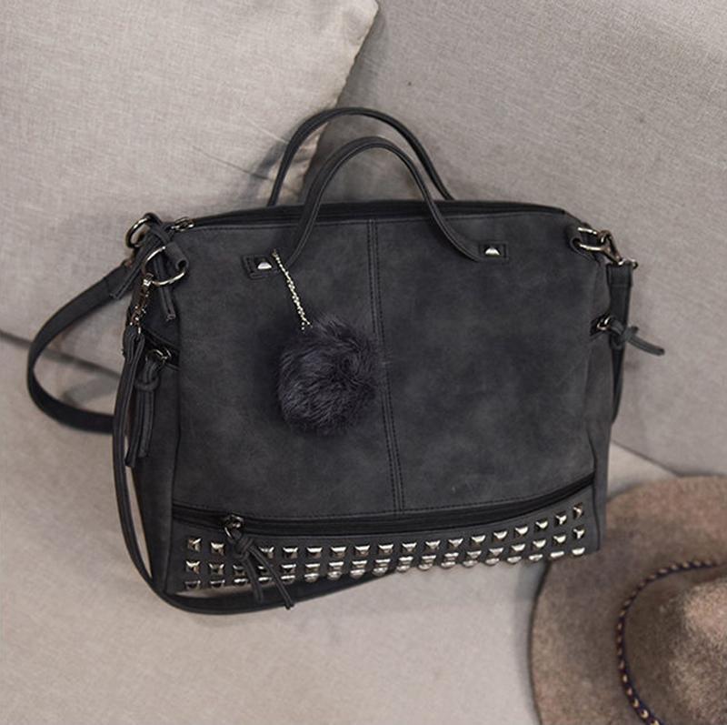Rustic Charm Leather Shoulder Bag – Stylish Cowgirl Handbag with rivet details on a sofa